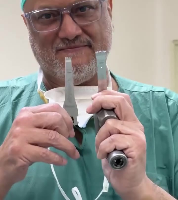 Dr Gobinder Singh demonstrating robotic-arm assisted knee replacement on a training model, with his own narration